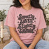 Sweetly Saved. Slightly Savage. retro bubble letter DTF transfer in black halftone texture with sparkly star accents on a pink shirt Shown on a Blossom t-shirt.
