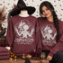 Gothic scissor-handed figure DTF transfer with castle, moon, and 'Everything Has Beauty But Not Everyone Sees It' script lettering Shown on a Heather Dark Maroon crewneck sweatshirt.