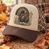 Vintage Wild Turkey DTF Transfer | Watercolor Thanksgiving Fall Design, vintage watercolor wild turkey with fanned tail and autumn foliage printed on a cream and brown trucker hat, styled with fall leaves and harvest corn
