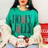 Holly Jolly Christmas DTF Transfer | Camo Tree Holiday Design, model wearing a green shirt with bold black “HOLLY JOLLY” lettering and camouflage Christmas trees, holding a Santa mug.