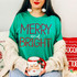 Merry and Bright DTF Transfer | Christmas Holiday Design, red and white “Merry and Bright” lettering displayed on a green shirt in a festive holiday outfit.