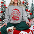 So Very Merry Santa DTF Transfer | Retro Christmas Design, retro red Santa face and “So Very Merry” design displayed on a gray sweatshirt worn in a festive Christmas setting.