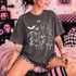 White ink Casper-style ghost nose-booping a furry grinning beast character with Boop script and bats on dark heather shirt