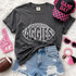 Aggies football outline DTF transfer in white hand-drawn lettering shaped like a football on a dark shirt