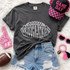 Skyhawks football outline DTF transfer in white hand-drawn lettering shaped like a football on a dark shirt