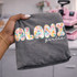 Alani Girlie DTF transfer with collage-style pastel floral print letters and white script lettering on a gray shirt