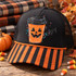 Coffee First jack-o-lantern coffee cup DTF transfer with carved pumpkin face, black lid, and colorful hand-drawn highlights and confetti dots Shown on a black foam front panel, orange-striped bill, black mesh back trucker hat.
