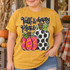 Fall Is My Happy Place DTF transfer with leopard print and polka dot pumpkins in hand-lettered script design Shown on a Mustard t-shirt.