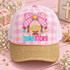 True Story Nativity DTF Transfer | Pink Gingham Christmas Manger Design, pink gingham nativity print featuring a manger, radiant star, decorative bow, and “True Story” lettering displayed on a gold glitter-brim trucker cap.