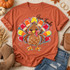 Give Thanks Turkey DTF Transfer | Cute Thanksgiving Fall Design, colorful hand-drawn turkey with bright feathers and “Give Thanks” lettering displayed on an autumn orange T-shirt