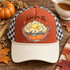 Here For The Mashed Potatoes DTF Transfer | Funny Thanksgiving Food Design, colorful mashed potatoes bowl with playful lettering displayed on a rust-orange and cream trucker hat surrounded by autumn pumpkins and fall leaves.