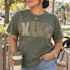 MAMA DTF transfer in block letters with checkerboard, camo, leopard, and polka dot patterns and cream bow accents Shown on a Moss t-shirt.