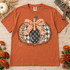 Faith Patchwork Pumpkin DTF Transfer | Hand-Lettered Fall Faith Design, orange autumn T-shirt featuring a patchwork pumpkin with a gingham bow, cross details, and hand-lettered faith message, styled with fall decor