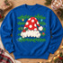Distressed vintage-sketch red and white polka-dot Santa hat DTF transfer with fur trim, holly berries, pine branches, and colorful stars Shown on a Sapphire crewneck sweatshirt.