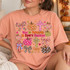 God Is Faithful In Every Season DTF transfer with polka-dot and floral pumpkins, plaid bows, and floral crosses in a colorful hand-lettered fall faith design Shown on a Peachy t-shirt.