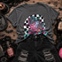 Pastel clawed dream slasher DTF transfer in fedora and striped sweater in front of a black and white checkered circle