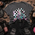 Pastel hockey mask slasher DTF transfer holding a machete in front of a black and white checkered circle
