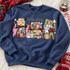 Pop-art Christmas movie mashup DTF transfer with polaroid-style frames featuring classic holiday movie characters, a leg lamp, BB gun, squirrel, and FRIENDS-style lettering Shown on a Heather Deep Royal crewneck sweatshirt.