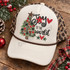 Joy to the World Christmas DTF transfer with hand-drawn tree decorated in red and leopard-print ornaments, bows, stars, and a barn-style star topper Shown on a cream foam front, brown rope, leopard mesh back trucker hat.