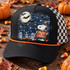Witch-hat beagle Trick or Treat DTF transfer with full moon, bats, tombstones, skulls, bones, and pumpkins on an orange shirt Shown on a Black front panel with a slim orange rope and black-and-white checkered mesh back trucker hat.
