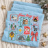 True Story nativity DTF transfer with hand-drawn sticker-sheet grid featuring the holy family, sheep, donkey, church, angel, manger, star of Bethlehem, cross, empty tomb, Christmas tree, and polka-dot bow framed by scribbly borders and snowflakes Shown on a Ice Blue t-shirt.