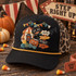 Vintage carnival-style Halloween DTF transfer with grinning black cat, top-hatted jack-o'-lantern, striped circus tent, bunting, and Enter Step Right Up signpost Shown on a black front panel with a mustard rope and leopard-print mesh back trucker hat.