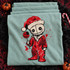 Stitched voodoo-doll Santa DTF transfer with rose tattoos, a bitten jack-o-lantern lollipop, and blood splatter detail on a shirt Shown on a Chalky Mint t-shirt.
