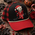 Stitched voodoo-doll Santa DTF transfer with rose tattoos, a bitten jack-o-lantern lollipop, and blood splatter detail on a shirt Shown on a black front panel with red pre-curved bill, cream rope, red and black buffalo-check mesh back trucker hat.
