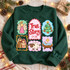 True Story Nativity DTF transfer with sticker-style panels featuring an angel, Christmas tree, holy family, lamb, and baby Jesus in a manger with scripture reference 2:1-20 Shown on a Forest crewneck sweatshirt.