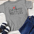 Kindness Matters Youth Screen Print Heat Transfer, gray T-shirt with kindness matters design and red heart.