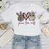 Peace Love Owls Pink Heart Sublimation Transfer, colorful owl with pink bow on its head, peace hand sign, and pink heart illustration on a white T-shirt, designed for customization.