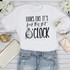 Looks like it's fuck this shit O'clock sublimation transfer, humorous white T-shirt with bold and cursive text and a pocket watch graphic, perfect for casual wear and making a statement.
