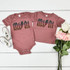 MINI ACDC Leopard Glitter INFANT Screen Print Heat Transfer, pink baby onesie and toddler t-shirt with leopard print AC/DC logo, next to white sneakers and pink and white roses.