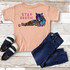 Stay Exotic FINAL STOCK - YOUTH Screen Print Heat Transfer T-shirt with colorful tiger and leopard design, paired with denim jeans and sneakers on a wooden surface.