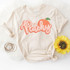 Just Peachy ADULT Screen Print Heat Transfer, peach design on a cream T-shirt with yellow sunflower and bracelets.
