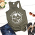 River Life Cuz Beaches Be Salty Screen Print Transfer tank top, olive green color with a scenic design of trees, a river, and a fishing boat