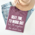 Okay Fine I'll Workout WHITE Screen Print Transfer, with a humorous quote on a mauve T-shirt.