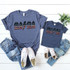 MINI AC/DC YOUTH Patriotic Screen Print Heat Transfer, matching navy blue t-shirt and jeans for kids and adults with white sneakers and green plant decor.