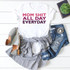 Mom Shit All Day Every Day FINAL STOCK Screen Print Heat Transfer T-Shirt, white graphic t-shirt with bold pink and purple text, casual outfit laid out with jeans, striped shirt, gray shoes, and accessories.