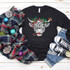 Shaggy Cow Bells and Bows Screen Print Heat Transfer T-shirt with festive holiday design featuring a bull's face decorated with holly, ribbons, and Christmas ornaments.