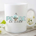 PEACE On Earth Sublimation Transfer, white ceramic mug with a peace-themed design and text, decorative flowers nearby.