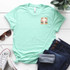 Brushstroke Cross POCKET Screen Print Heat Transfer, mint green T-shirt withprint design on the chest.