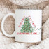 I'm Fine It's Fine, Everything Is Fine Christmas Sublimation Transfer mug with Christmas tree design and humorous text on a cozy blanket.