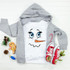 Snowman Face Sublimation Transfer, a cute snowman face design on a white T-shirt with a gray hoodie, surrounded by Christmas decorations and shoes.