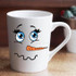 Snowman Face Sublimation Transfer, white ceramic mug with cute snowman face design featuring big blue eyes, an orange carrot nose, and a wavy mouth.