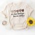 Love One Another Screen Print Heat Transfer T-shirt, cream-colored T-shirt with heart-shaped designs and a quote from John 13:34.