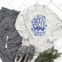 Let It Snow Somewhere Else Screen Print Heat Transfer sweatshirt, casual cozy off-white sweatshirt with blue snowflake and decorative text design.