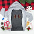 Patterned Trees YOUTH Screen Print Heat Transfer, gray and leopard print tree design on a dark gray shirt surrounded by Christmas decorations.