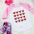 Red Hearts Metallic YOUTH Screen Print Transfer, pink and white raglan shirt with a pattern of red metallic hearts on it.