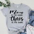 Mom Is The Name Chaos Is The Game Screen Print Heat Transfer T-Shirt, casual gray t-shirt with black text, laid on a textured surface with jeans and sneakers.